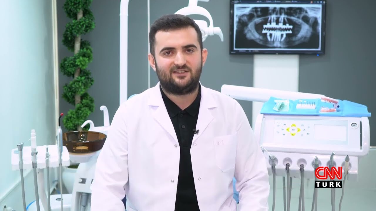 Dr. Sadullah Daştan performing a dental implant procedure